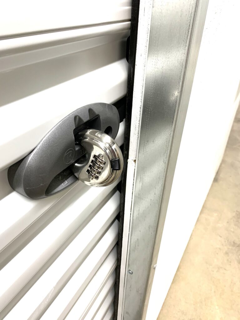 Secure storage unit latch and lock on roll-up door at Eyota storage facility