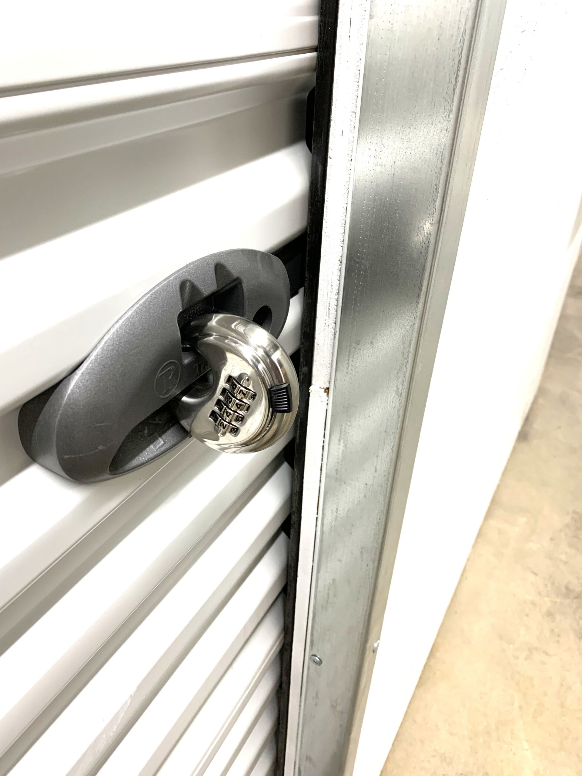 Secure storage unit latch and lock on roll-up door at Eyota storage facility