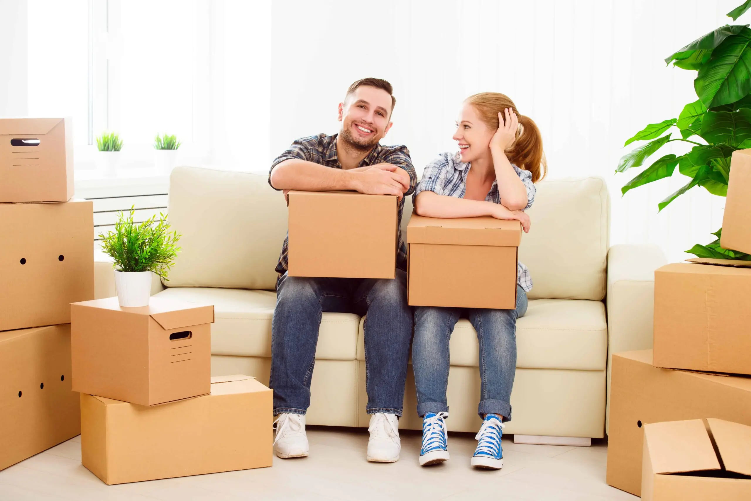A couple organizing boxes for storage