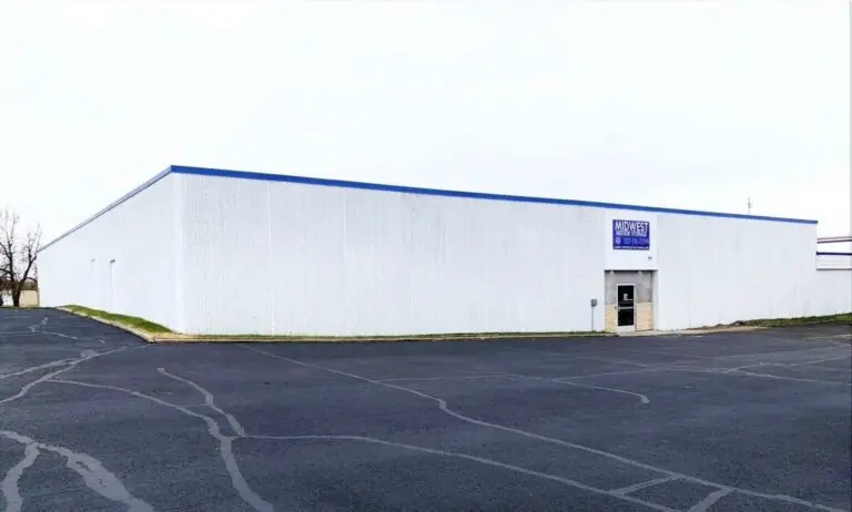 Facility exterior and paved parking area at Midwest Indoor Storage in Albert Lea, MN